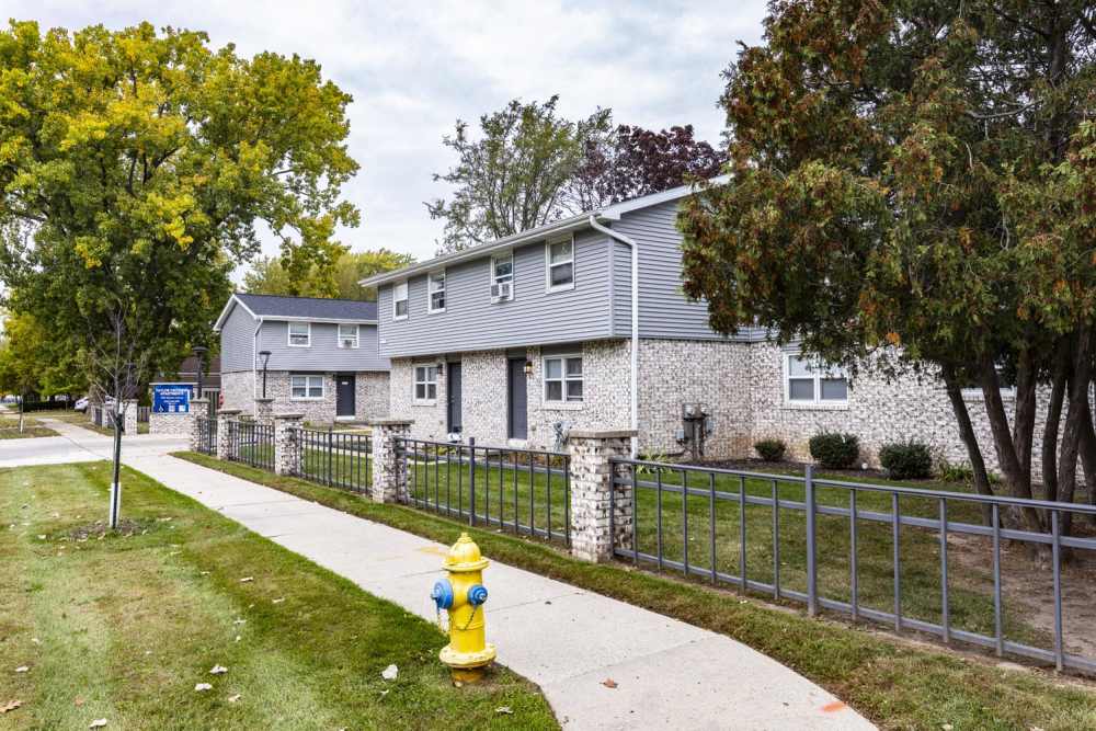 Community area with a walking track at Taylor Crossing in Green Bay, Wisconsin