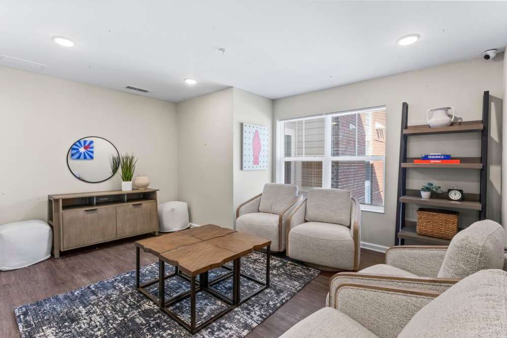Living room with wood flooring and couch at Stanton Park Apartments in Atlanta. GA