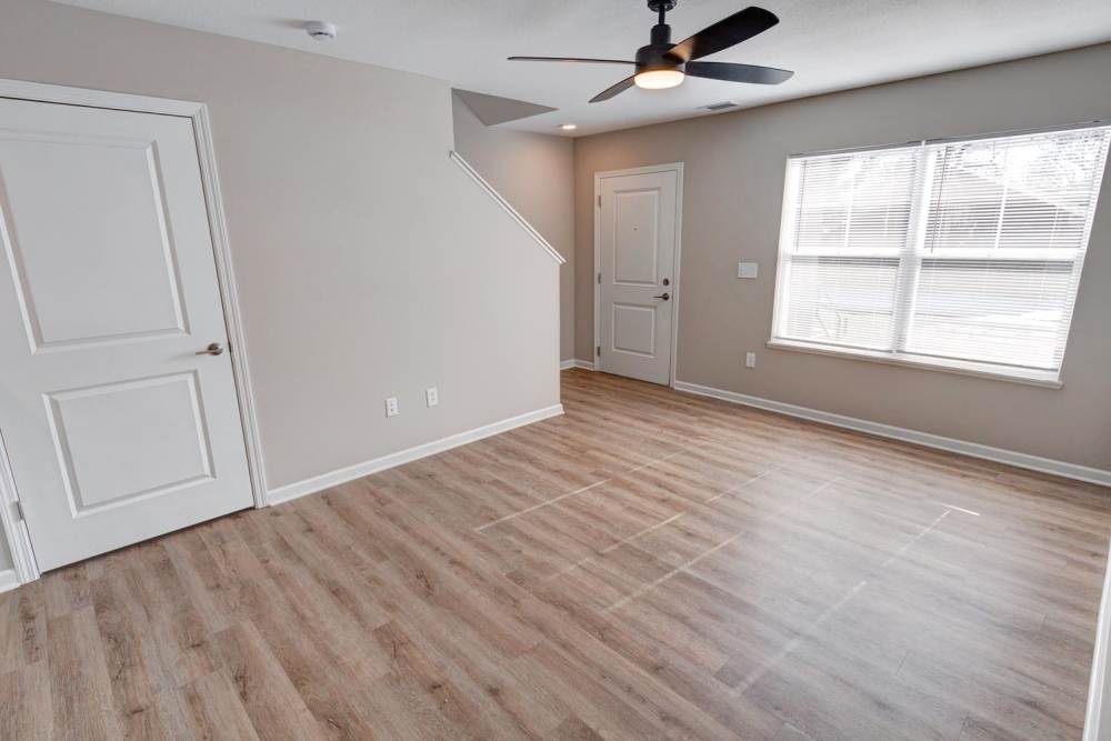Townhome with abundant lighting and stairs to the next level at Stanley Terrace in Plainfield, Indiana