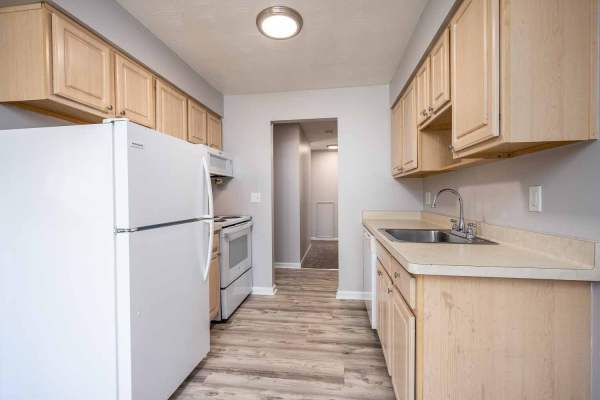 Kitchen with white color appliance  at Eastway Manor Apartments in Webster, New York 