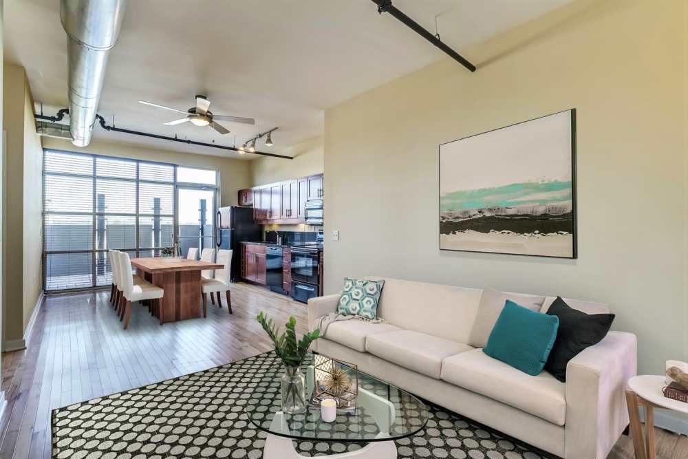 Living room with access to kitchen at Perry Street Lofts in Petersburg. VA