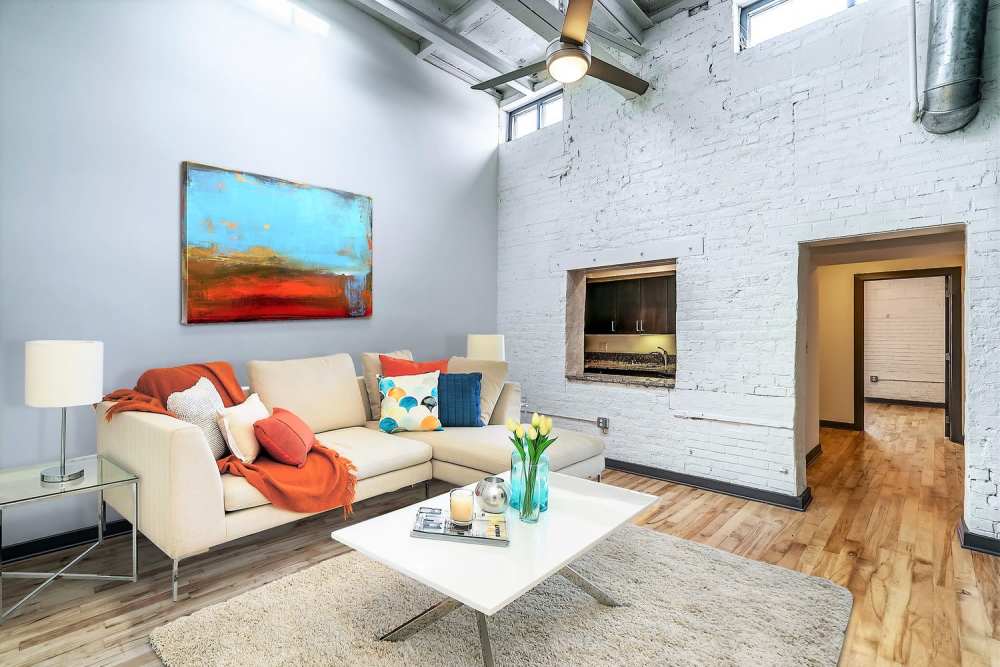 Living room with couch at Perry Street Lofts in Petersburg. VA