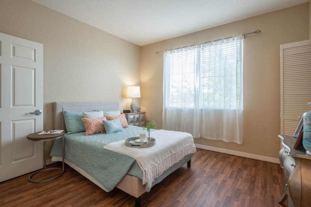 Spacious bedroom with bed and large window at Grand Villa of Ocala in Ocala, Florida