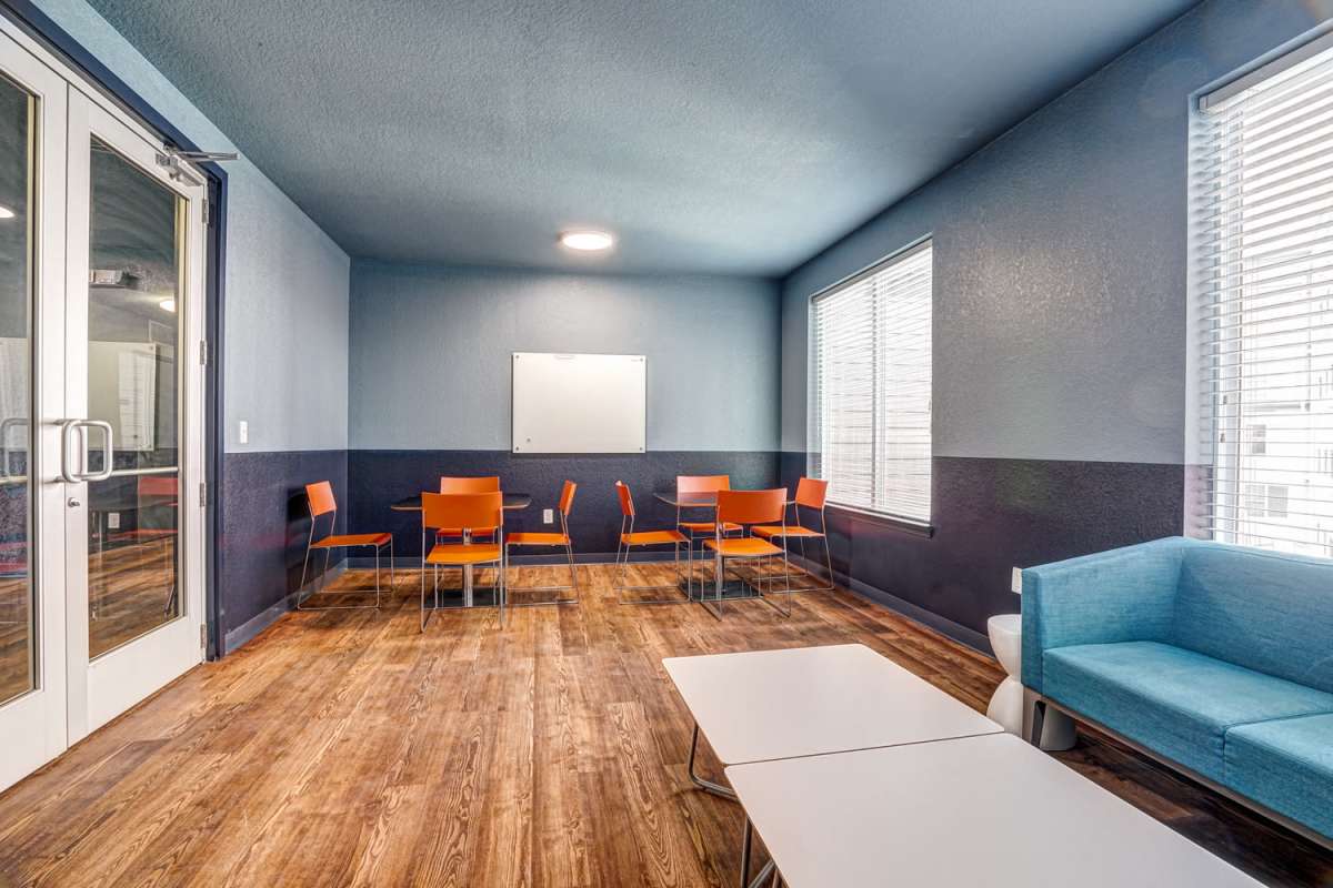 Community seating area with large window at The Nine in Louisville. KY