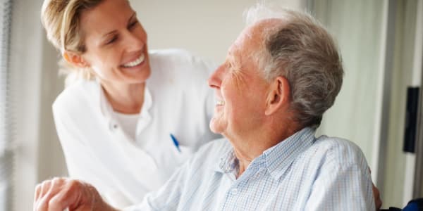 Resident and nurse discussing care plans at Geneva Lake Manor in Lake Geneva, Wisconsin