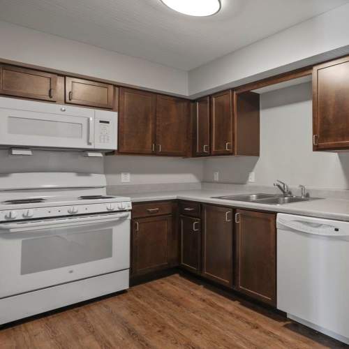 Beautiful kitchen with modern white sleek appliances at Wheatland Crossing II in Columbus, Ohio