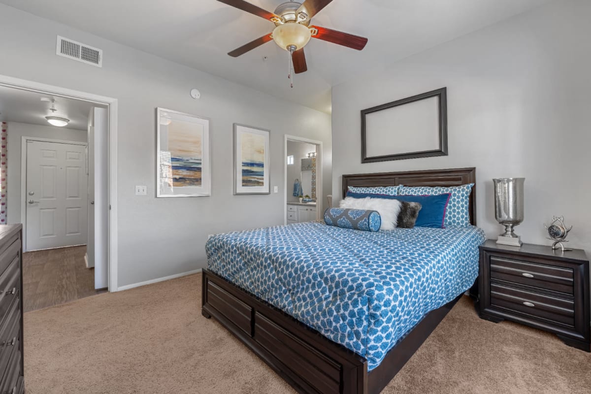 Carpeted bedroom with private bathroom at Alante at the Islands in Chandler, Arizona