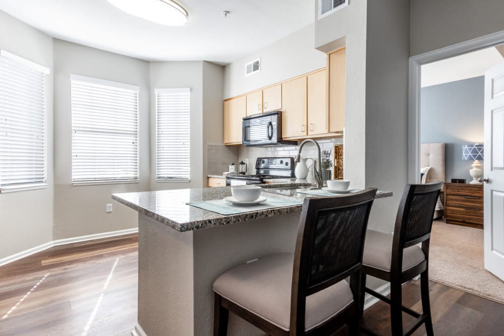Oversized island kitchen for cooking and entertaining at The Links at Plum Creek in Castle Rock, Colorado