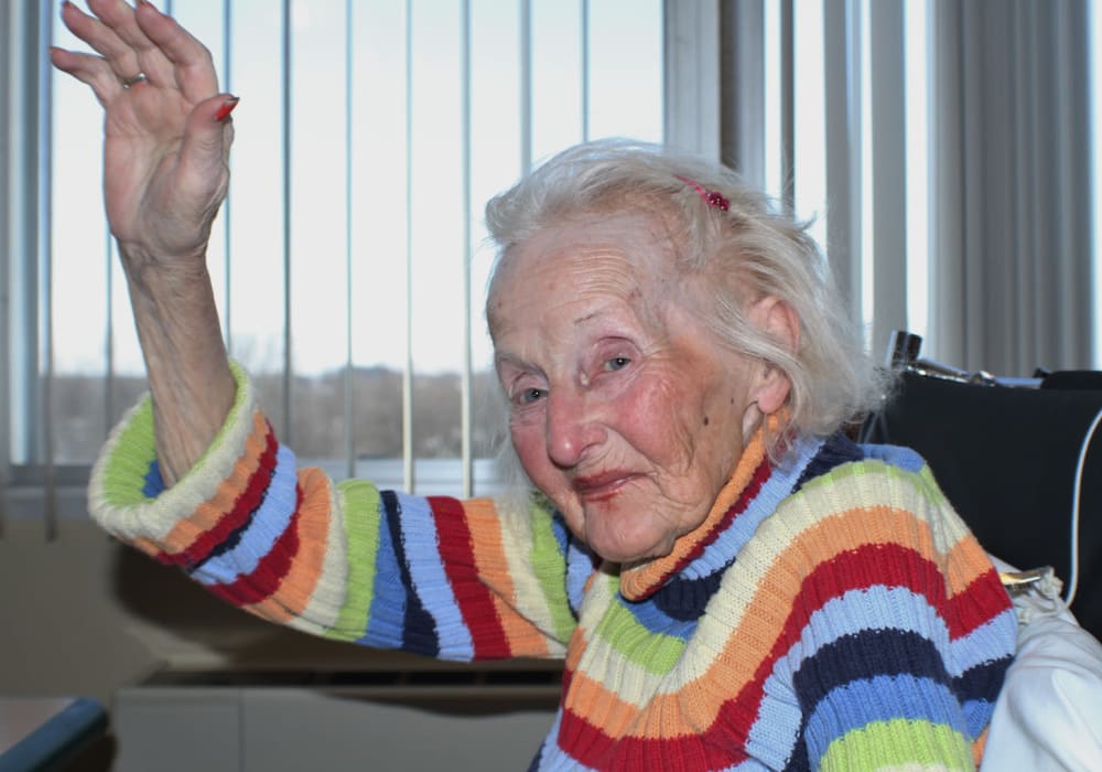 Smiling resident in a colorful sweater at Edgerton Care Center in Edgerton, Wisconsin