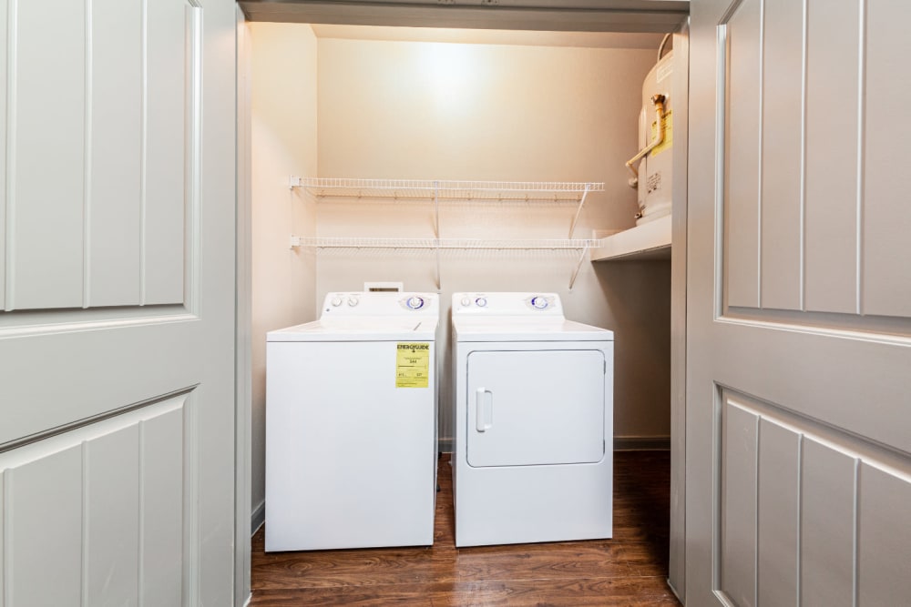 Full size washer and dryer in closet at Marquis at Katy in Katy, Texas