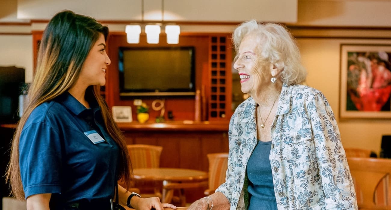 A staff member goes over options with a patient at Sunshine Villa, A Merrill Gardens Community in Santa Cruz, California. 