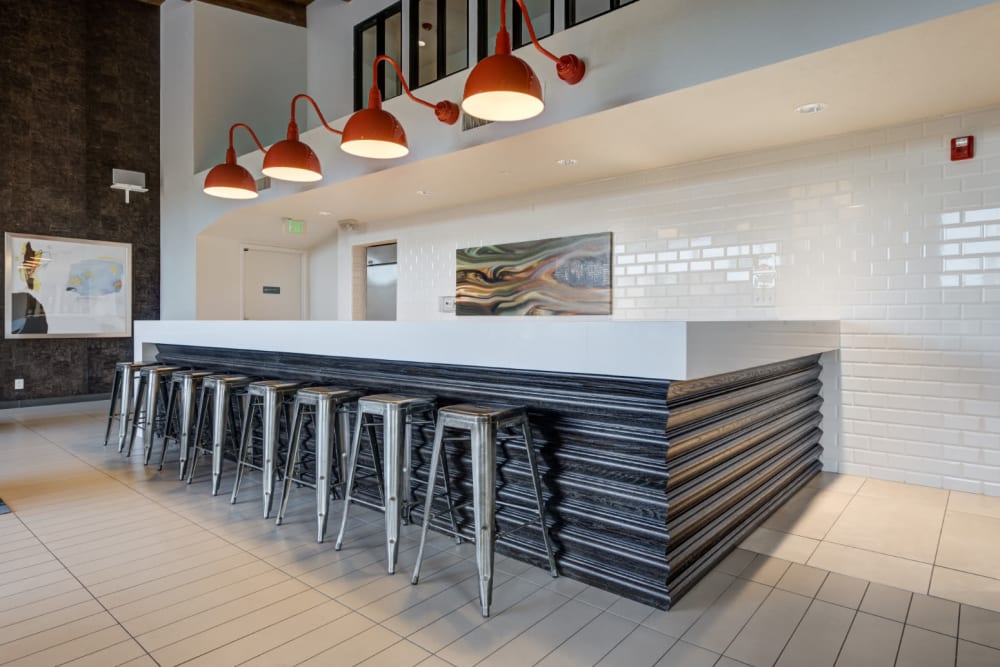 Overstated clubhouse with kitchen for entertaining and enclosed movie theater at Ashford Belmar in Lakewood, Colorado