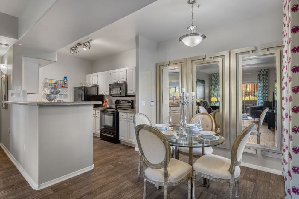 Dining table for four with kitchen in background at Alante at the Islands in Chandler, Arizona