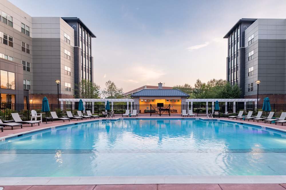 dusk view of pool at The Residences at Annapolis Junction in Annapolis Junction, Maryland