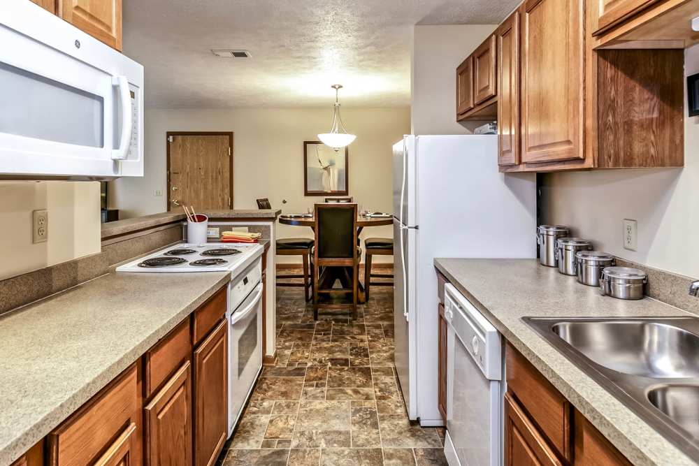 Kitchen with oven, microwave and stove at The Falgrove Apartments in Omaha, Nebraska