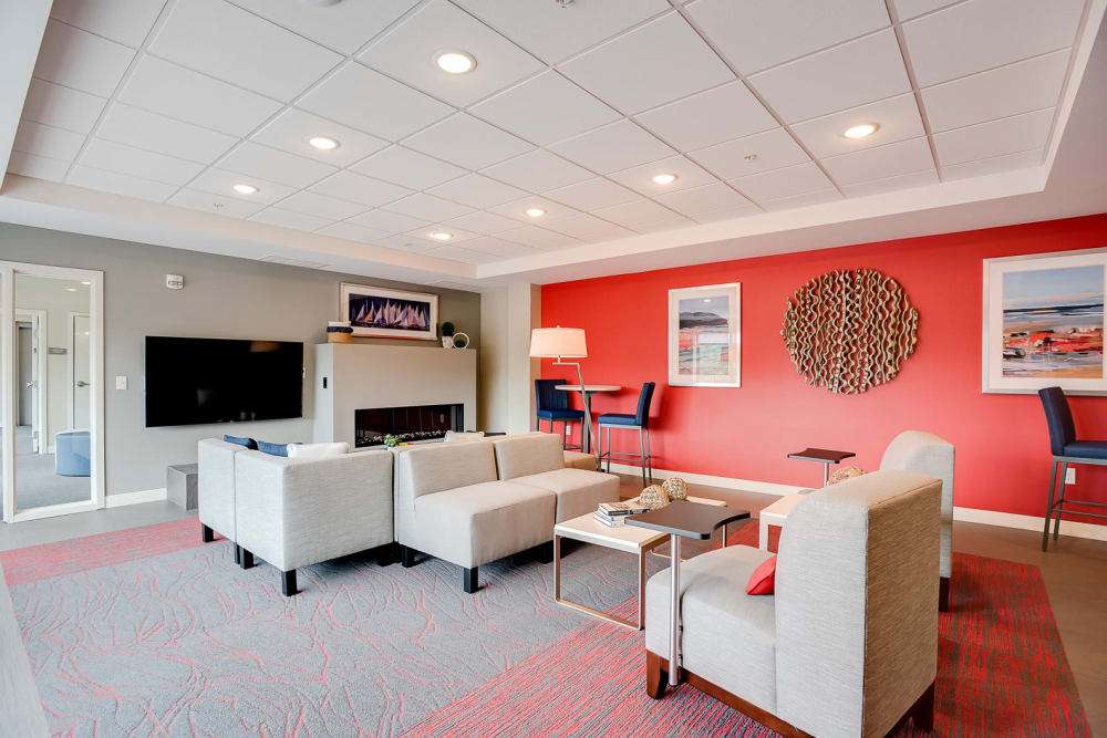 A clubhouse with a large fireplace at Lake Jonathan Flats in Chaska, Minnesota