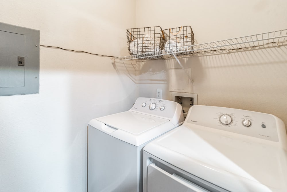 Laundry room with full size washer and dryer at Marquis of Carmel Valley in Charlotte, North Carolina
