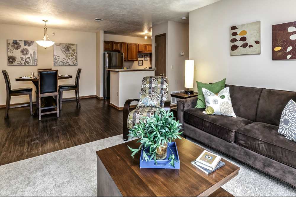 Living room with close access to dining and kitchen area at The Falgrove Apartments in Omaha, Nebraska