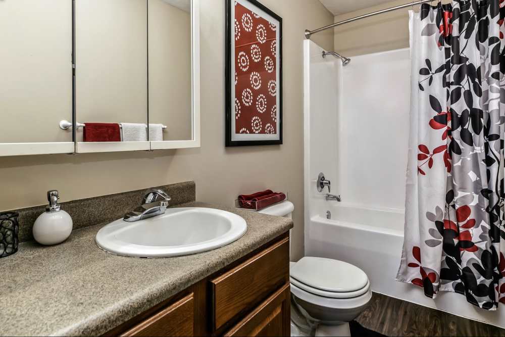 Bathroom with tub at The Falgrove Apartments in Omaha, Nebraska