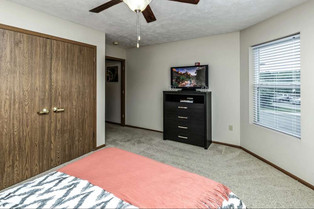 Bedroom with television at The Falgrove Apartments in Omaha, Nebraska