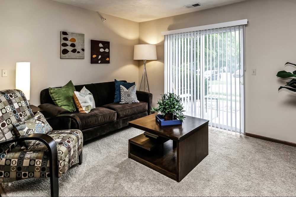Living room with access to balcony at The Falgrove Apartments in Omaha, Nebraska