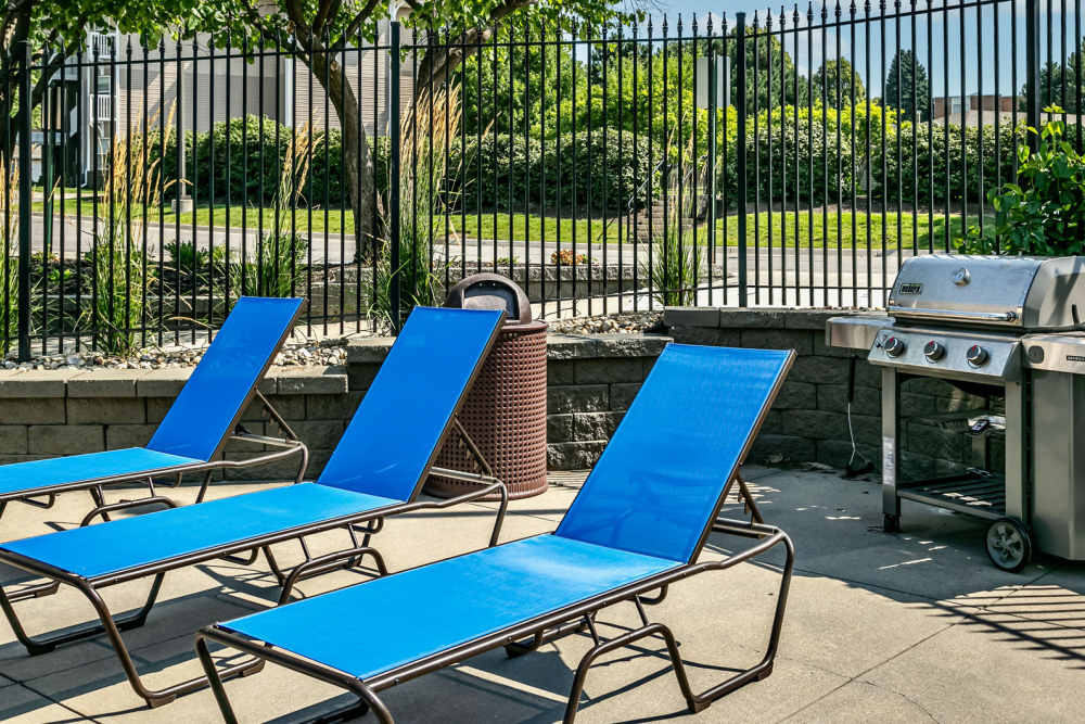 Grilling station by the pool at The Falgrove Apartments in Omaha, Nebraska