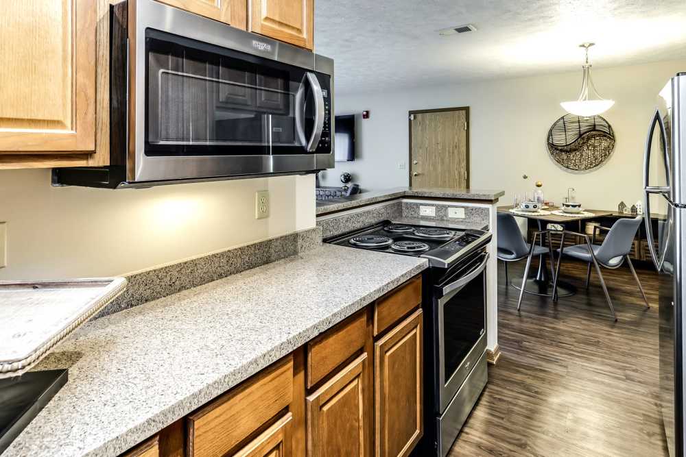 Kitchen with access to dining area at The Falgrove Apartments in Omaha, Nebraska