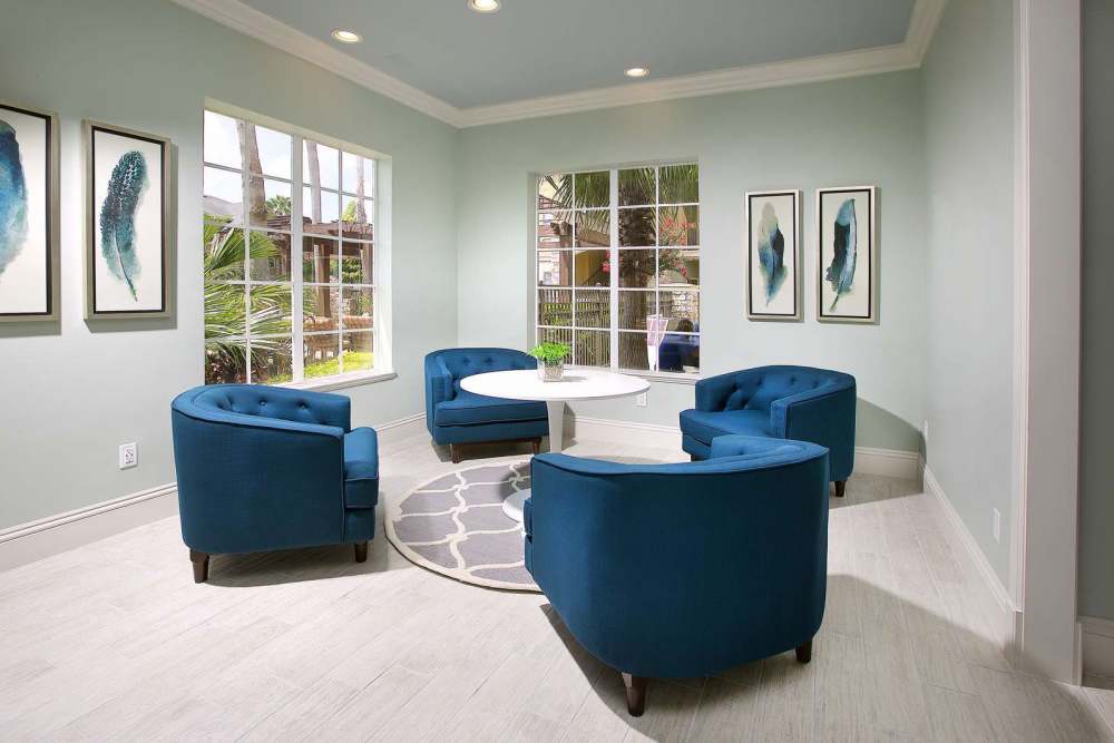 Community area with chairs and tables at Dawson in Orlando, Florida