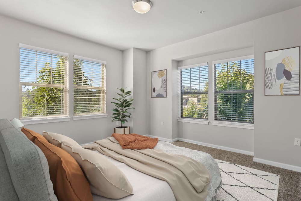 Cozy well-lit bedroom at The Fairway Apartments in Salem, Oregon