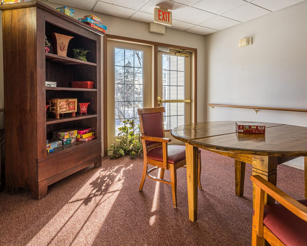 Sunlit game room at Traditions of Owatonna in Owatonna, Minnesota.