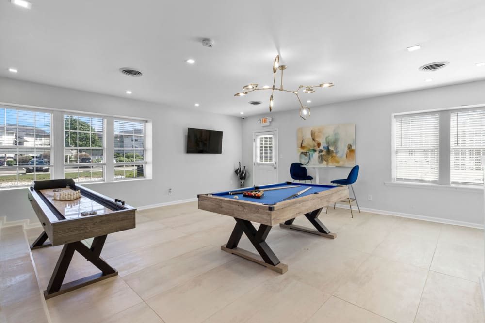 Residents clubhouse with billiards and shuffleboard at Astoria Park Apartment Homes in Indianapolis, Indiana