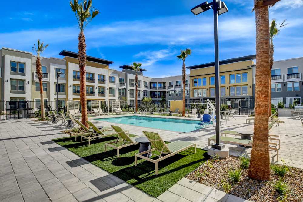 A view of the swimming pool with lounge chairs at Heirloom at Rome in Las Vegas, Nevada