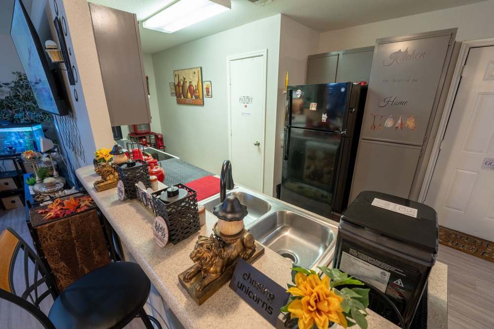 Kitchen with refrigerator at Bolivar Homes in Cleveland,Mississippi