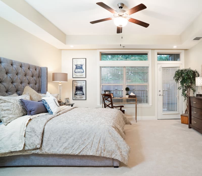 A cozy resident bedroom at Celebration Village Forsyth in Suwanee, Georgia