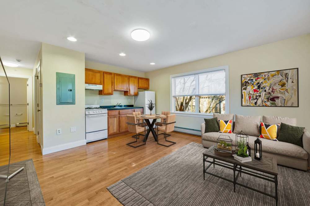 Living room with view to kitchen at One Neighborhood Builders in Providence, Rhode Island