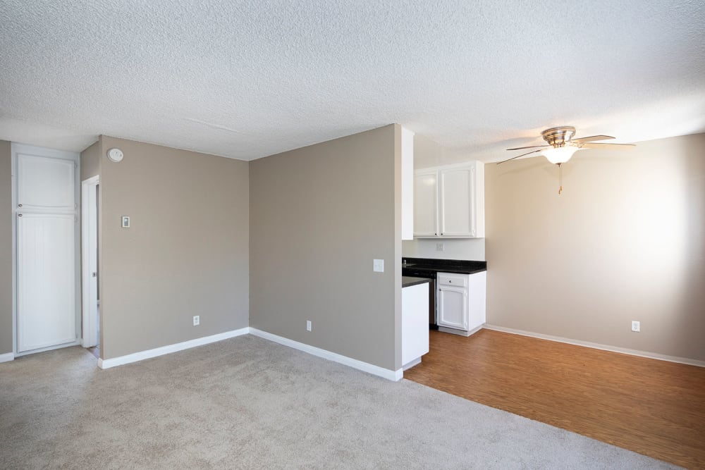 Living room and kitchen at Royal Village Apartments in San Diego, California