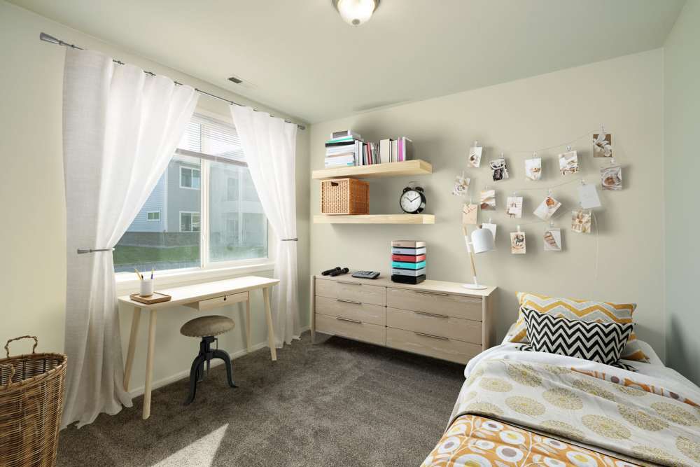 Bedroom with study table at Regency Apartment Homes in Williston, North Dakota