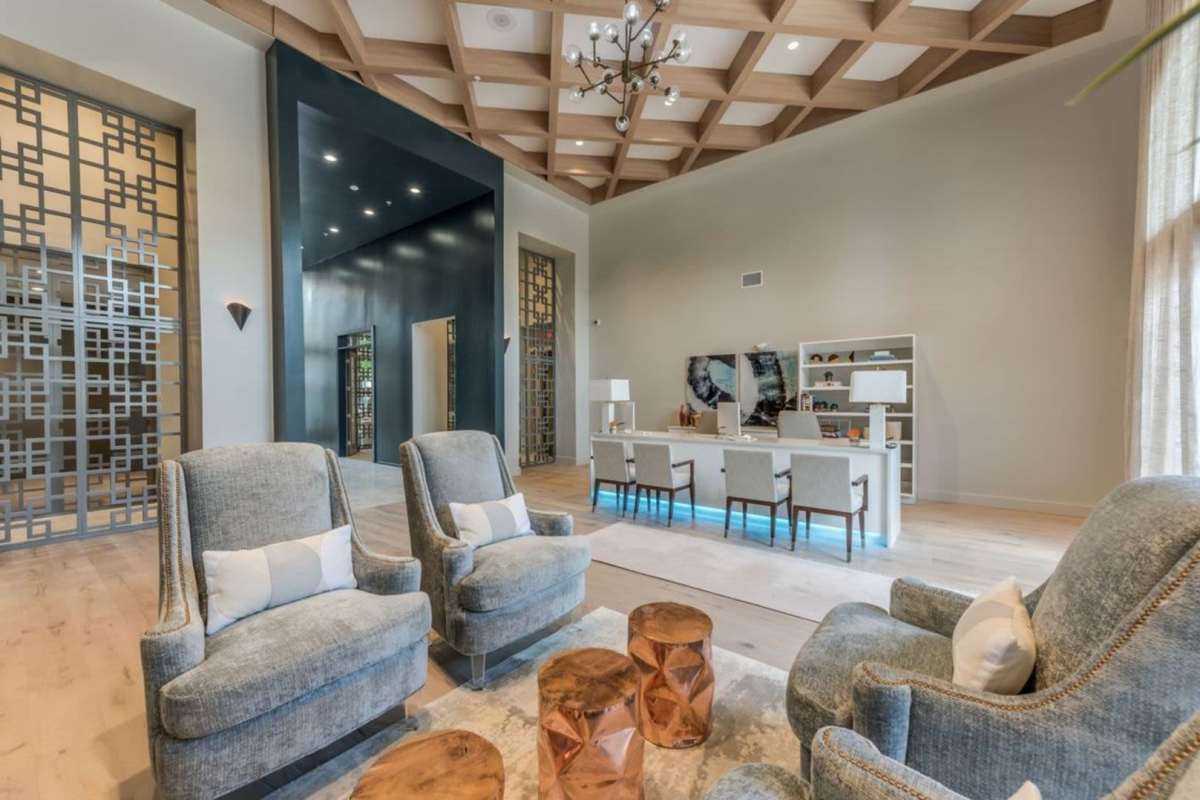Lounge area with comfortable seating and office area at Villas At Bunker Hill, Houston, Texas