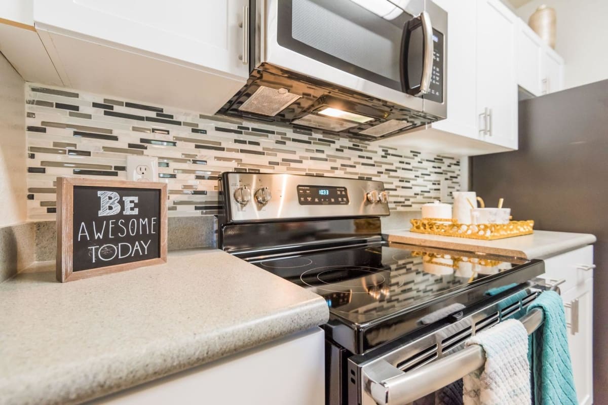 White cabinets in an apartment kitchen at Citrus Tower in Clermont, Florida