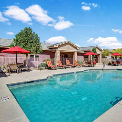 Shimmering pool with lounge chairs at Tierra Vida in Tucson, Arizona