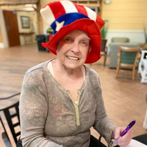 Resident playing bingo at Oxford Glen Memory Care at Owasso in Owasso, Oklahoma