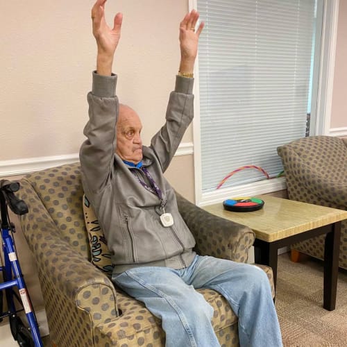A resident doing chair exercises at FountainBrook in Midwest City, Oklahoma