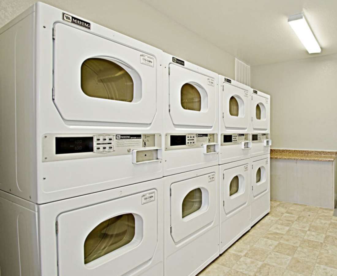 Large laundry area with washers and dryers at 544 Southern Apartments in Mesa, Arizona