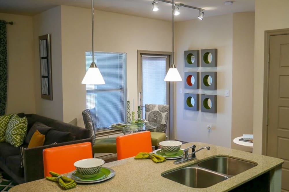 View of living room and dining area from kitchen island at The BLVD in San Angelo, Texas
