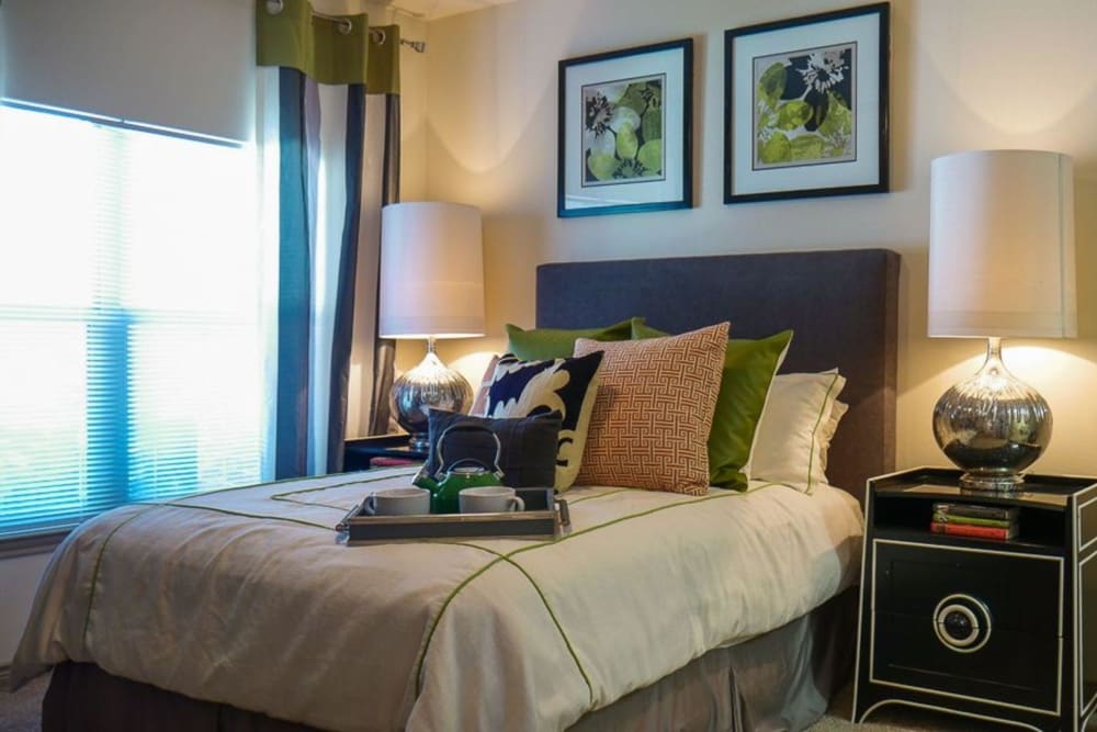 Model bedroom with large window at The BLVD in San Angelo, Texas