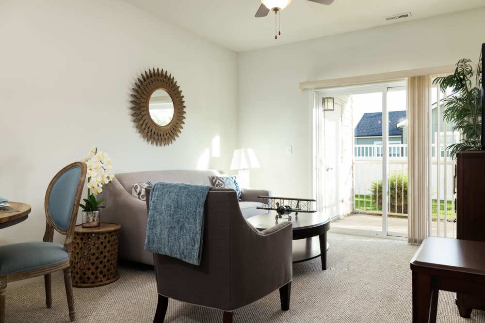 Living room with doors to patio at Regency Apartment Homes in Williston, North Dakota
