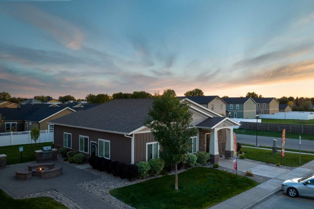 Clubhouse exterior with firepit at Regency Apartment Homes in Williston, North Dakota