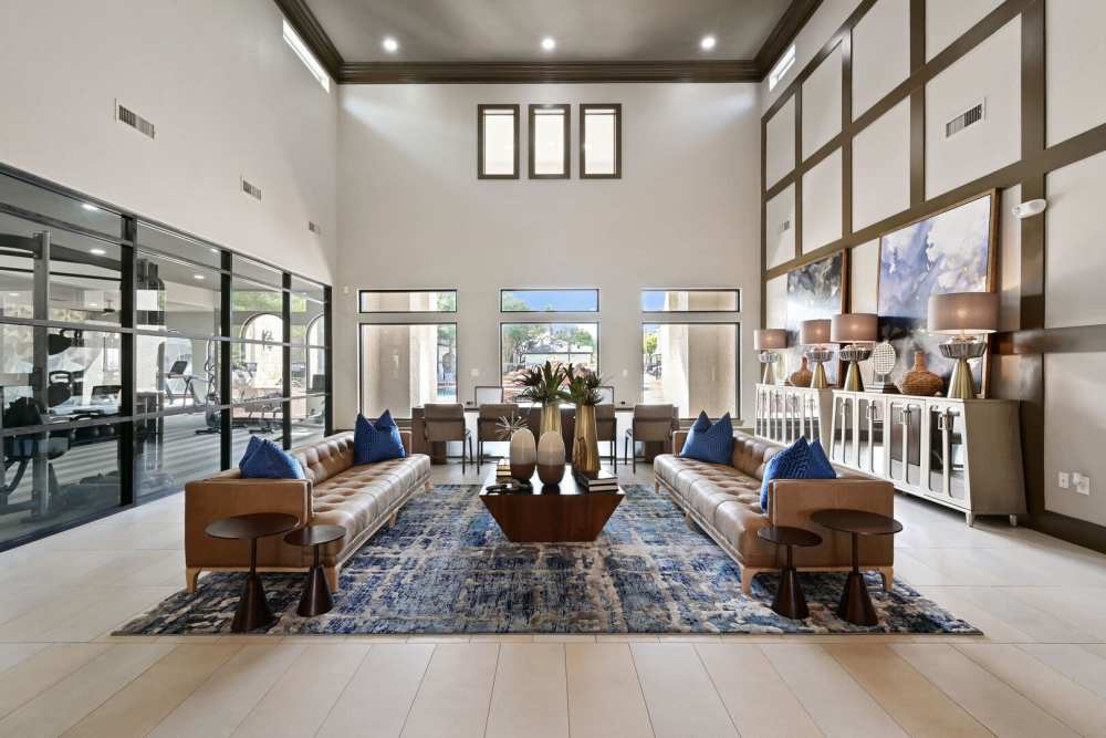 Community clubhouse with seating and large windows at Florence in Houston, Texas