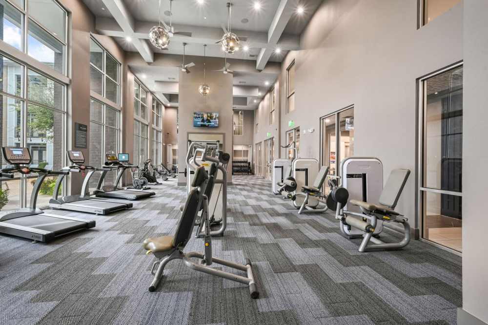 Fitness center with treadmills and other equipment at Kade in Dallas, Texas