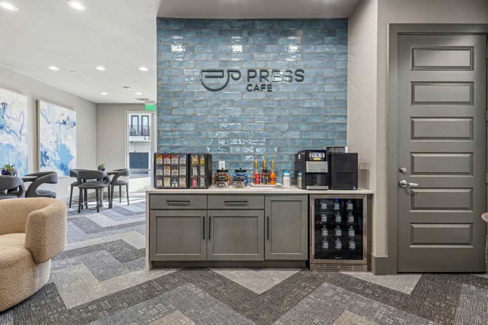 Clubhouse with cafe and wood cabinet at Kade in Dallas, Texas